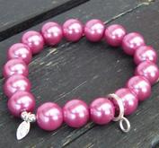 Berlockarmband med rosa glaspärlor